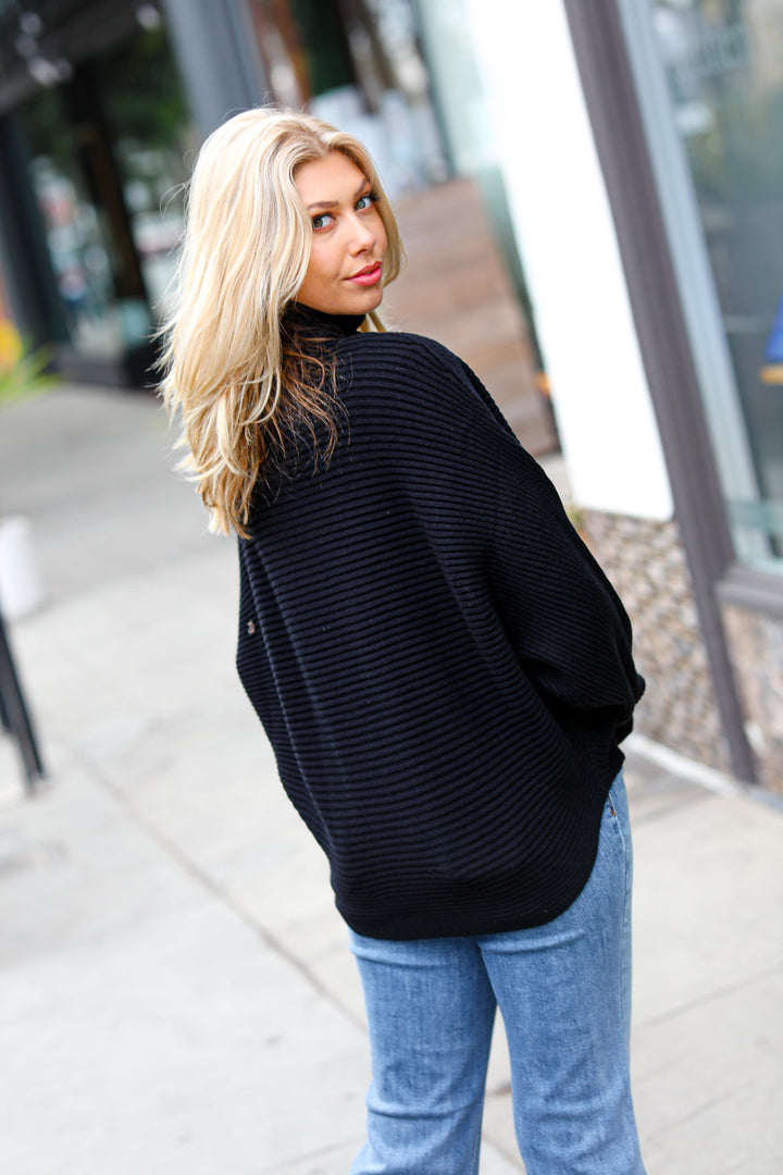 Lady In Black Ribbed Turtleneck Dolman Sweater