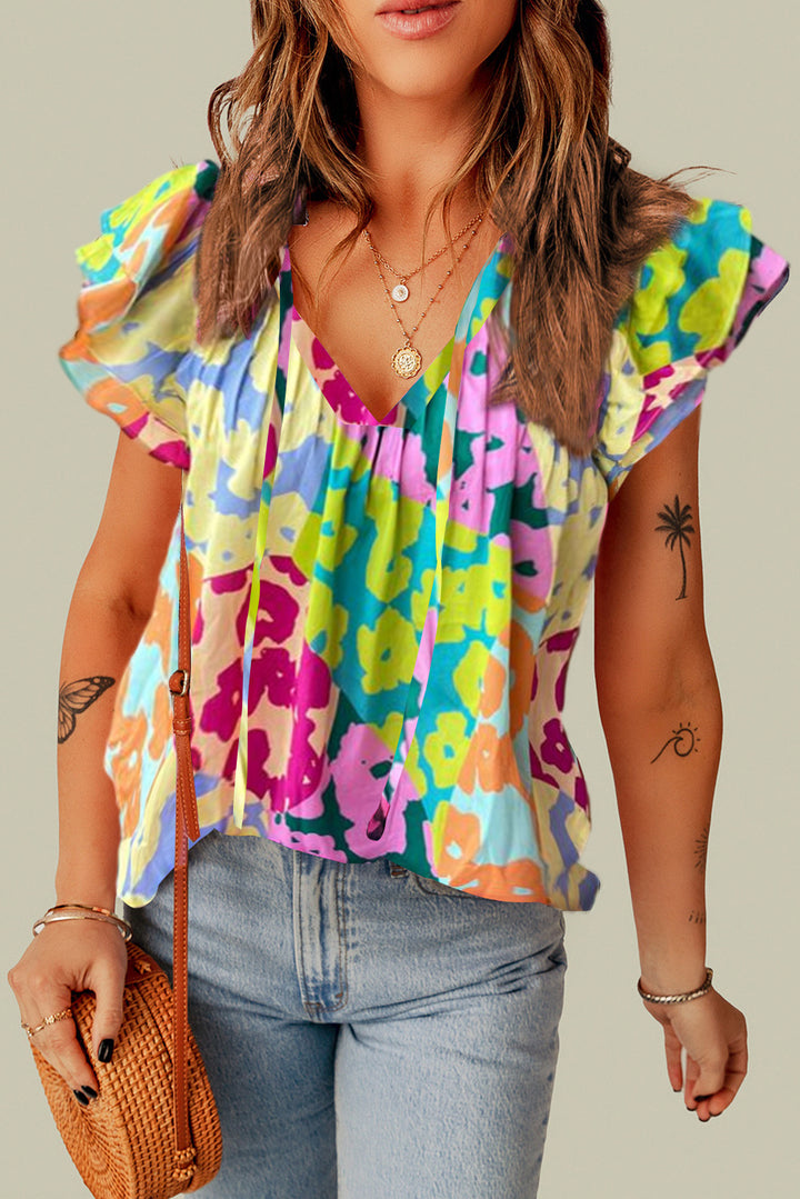 Ruffled Printed Tie Neck Cap Sleeve Blouse